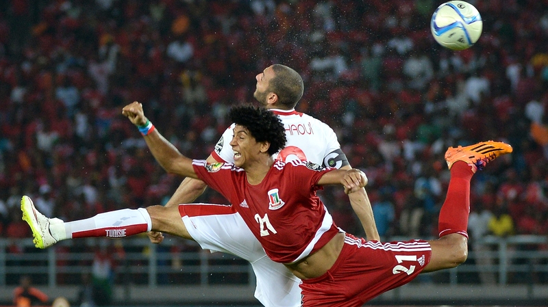 Equatorial Guinea's Ivan Esono (front) challenges Tunisia's Yassine Chikhaoui