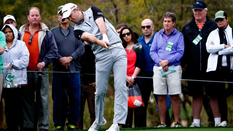 Martin Laird of Scotland hits a tee shot on the ninth hole
