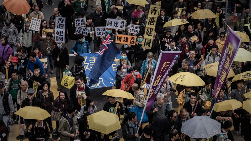 Around 12,000 people marched through Hong Kong's shopping and financial districts