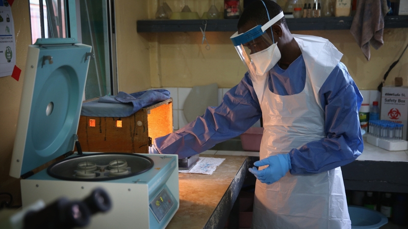 A health worker tests lab samples at Redemption Hospital which had formerly been used as an Ebola holding centre near Monrovia, Liberia