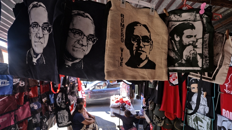 A stall selling t-shirts featuring Archbishop Oscar Romero's image in San Salvador