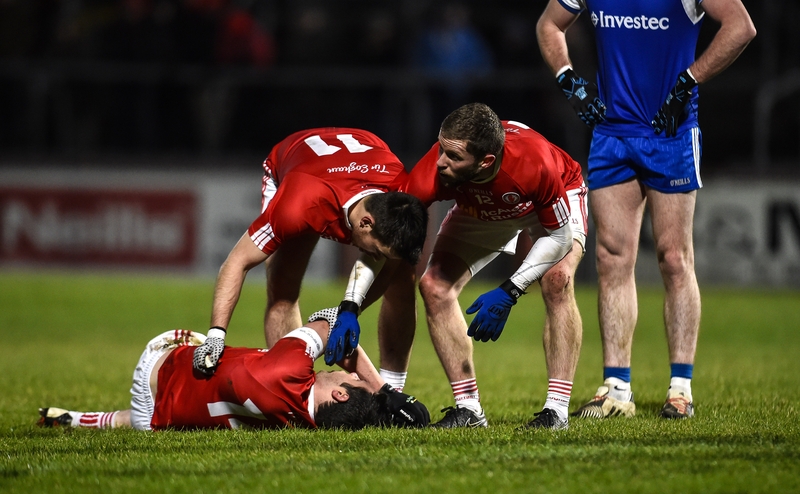 Tyrone's Sean Cavanagh is tended to by team mates after going down injured against Monaghan