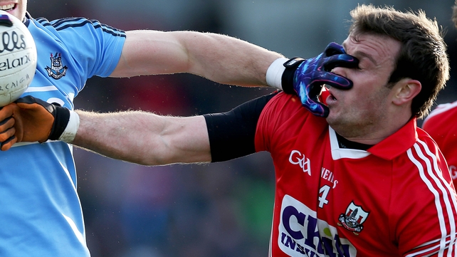 James Loughrey of Cork feels the force of a Dublin player during their Allianz League game on Sunday
