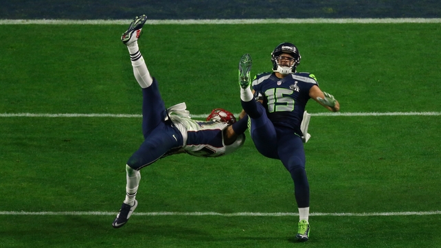 Jermaine Kearse #15 of the Seattle Seahawks makes a catch against Malcolm Butler #21 of the New England Patriots in the fourth quarter during Super Bowl XLIX