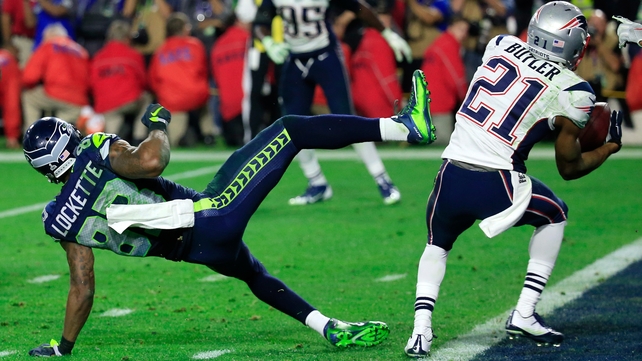 Malcolm Butler #21 of the New England Patriots intercepts a pass by Russell Wilson #3 of the Seattle Seahawks intended for Ricardo Lockette #83 late in the fourth quarter of Super Bowl XLIX