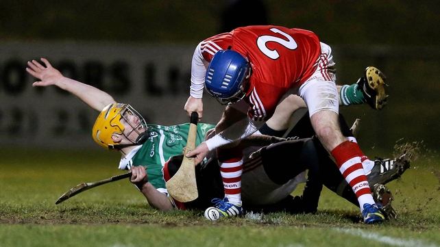 Limerick's Adrian Breen with William Kearney and Patrick Collins of Cork during the Waterford Crystal Cup final on Saturday