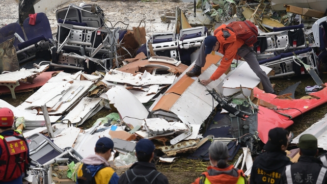 A worker sifts through the wreckage