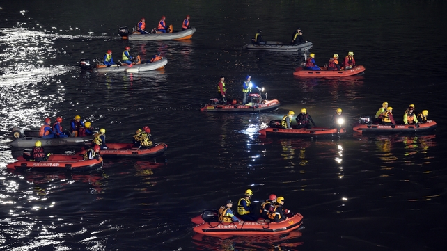 Rescue teams search the river