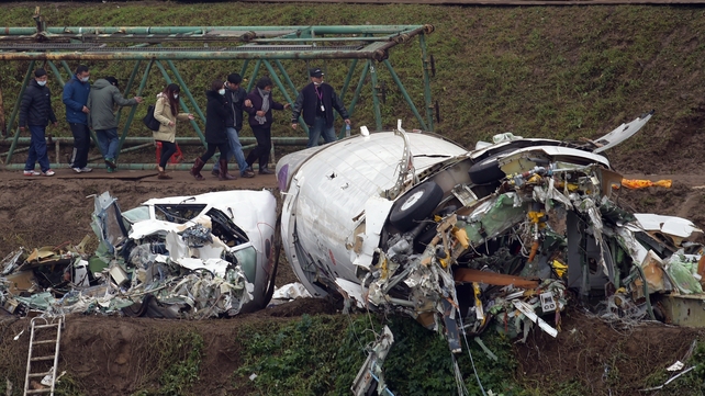 Relatives of those on board the plane at the crash site