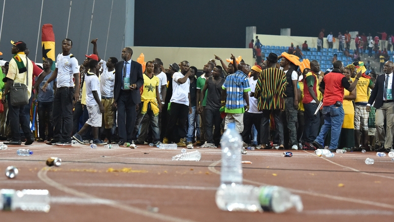 Ghana supporters try to get out of the stadium
