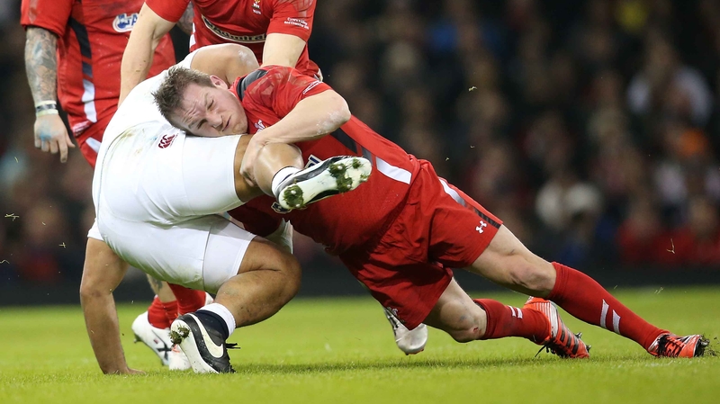 George North tackles England's Billy Vunipola in Cardiff last night