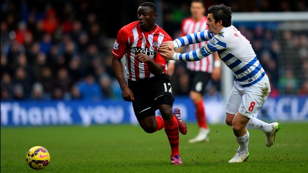 Victor Wanyama of Southampton battles for the ball with QPR's Joey Barton