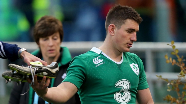 Ian Keatley gives away his boots after the game