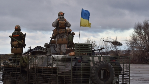 A Ukrainian helicopter flies past the headquarters of the Ukrainian forces in Kramatorsk