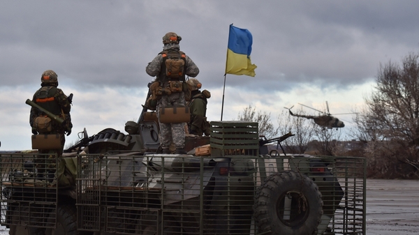 A Ukrainian helicopter flies past the headquarters of the Ukrainian forces in Kramatorsk