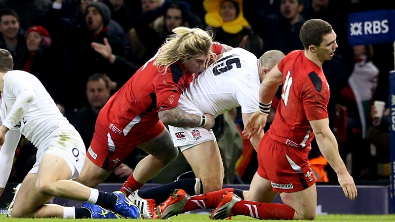 Wales' George North falls to the ground injured following a collision with his team-mate Richard Hibbard in Wales' game against England