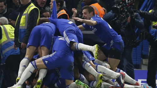 Willian celebrates with his Chelsea team-mates after scoring the only goal of the game