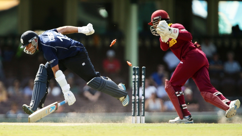 Kyle Coetzer of Scotland slides in to avoid a runout during the ICC Cricket World Cup warm up match between the West Indies and Scotland