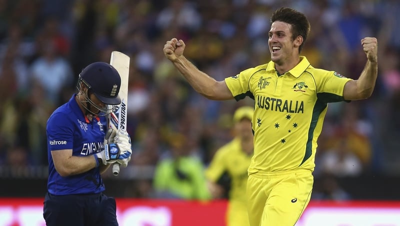 Mitch Marsh of Australia celebrates after taking the wicket of Eoin Morgan