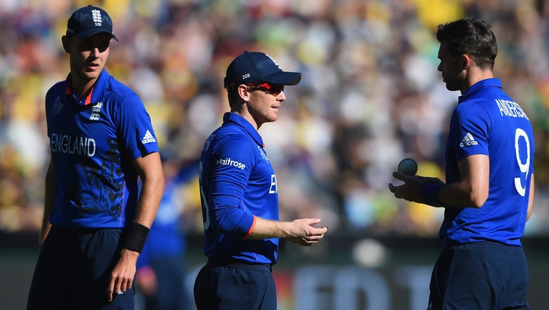 Eoin Morgan talks with bowler James Anderson as Stuart Broad looks on during England's game with Australia