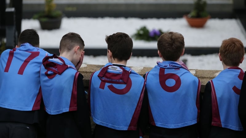 Classmates wearing GAA jerseys at the funeral of Oisin McGrath