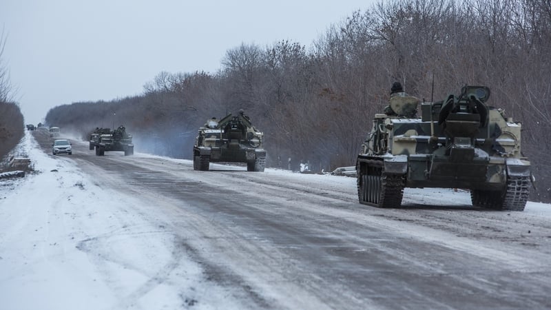 Ukrainian soldiers drive in the direction of the embattled town of Debaltseve