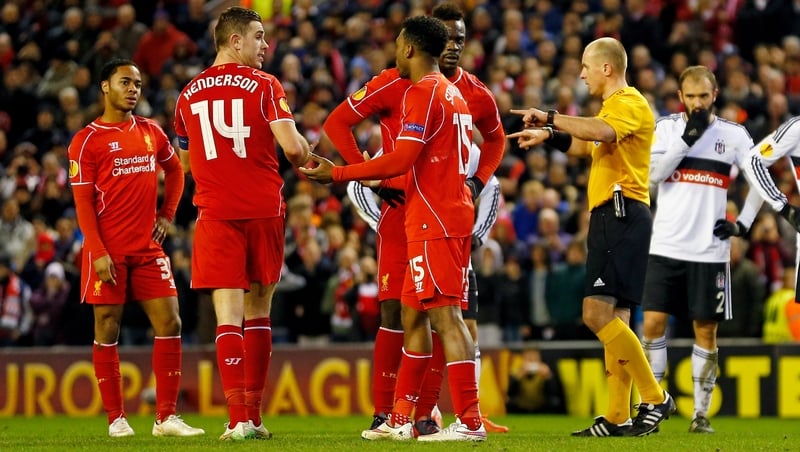 Liverpool players squabble over the penalty