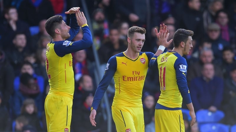 Olivier Giroud of Arsenal (L) celebrates with Calum Chambers and Mesut Oezil after scoring their second goal