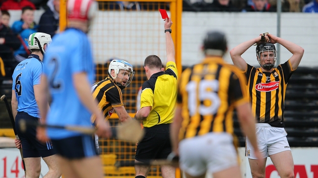 Referee Colm Lyons shows Jonjo Farrell of Kilkenny a red card