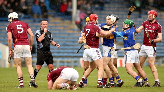 Referee James McGrath looks on as tempers flare between Tipperary and Galway