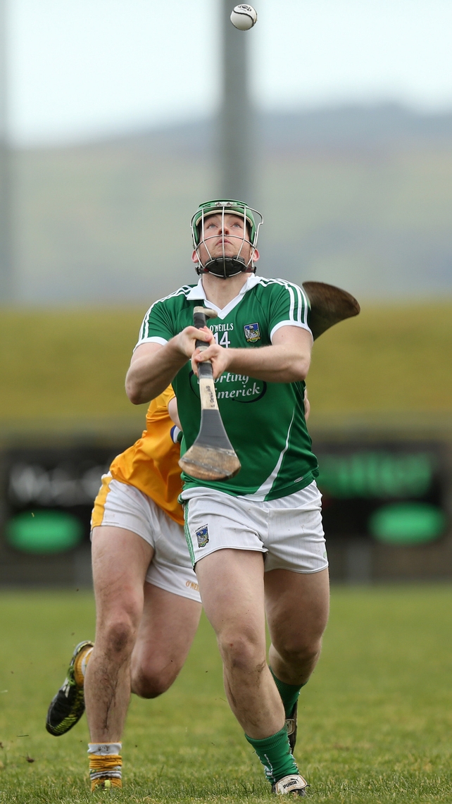 Limerick's Shane Dowling plays a clever overhead pass during the game against Antrim on Sunday