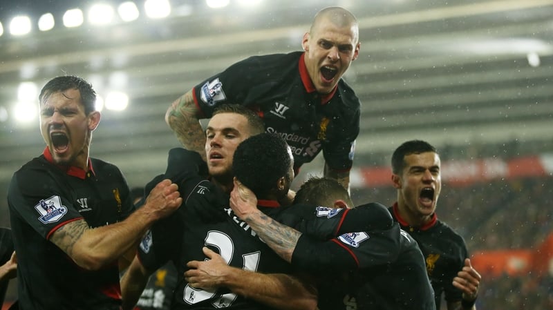 Liverpool's Raheem Sterling (C) is congratulated by teammates after scoring against Southampton