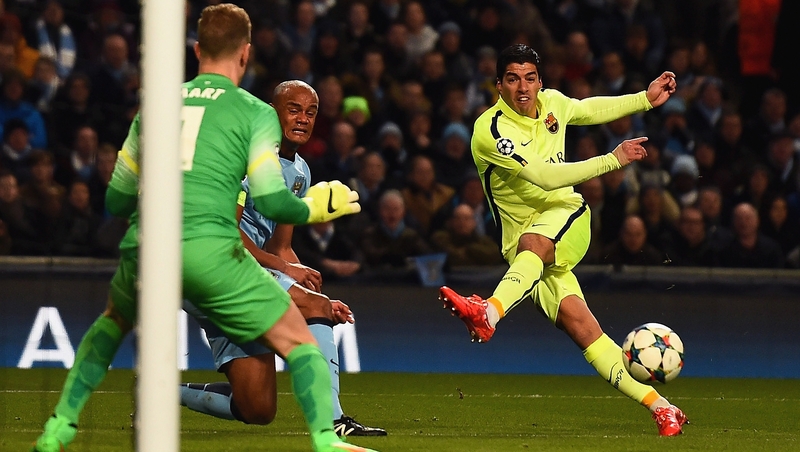 Luis Suarez guides Barcelona's opening goal past Joe Hart