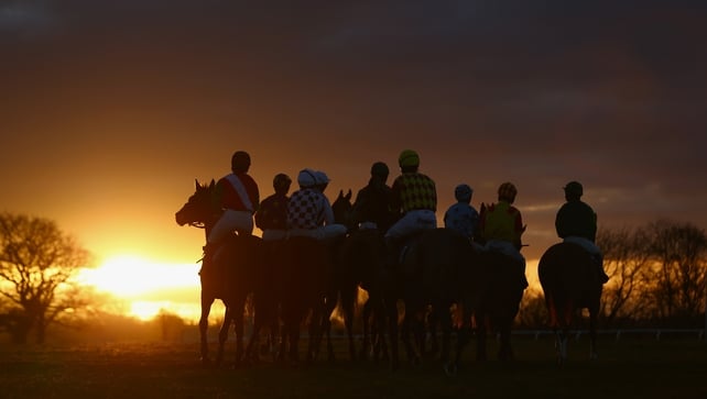 Horses and riders gather for the final race at Taunton Racecourse in England