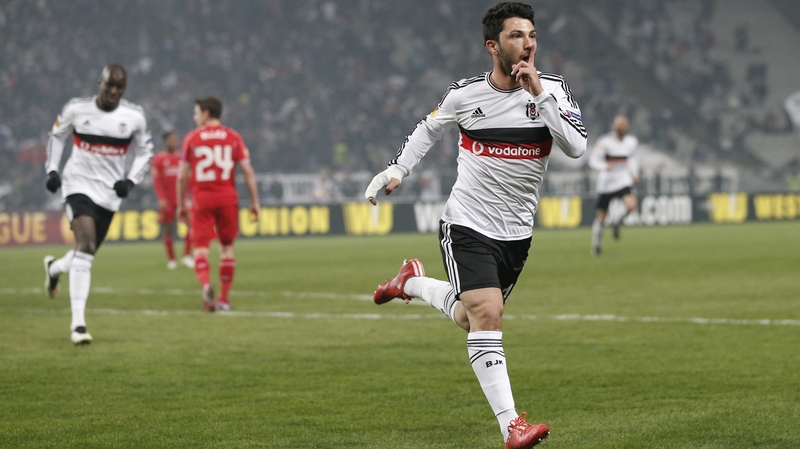 Besiktas' Tolgay Arslan (R) celebrates after scoring in the second-half to draw the teams level on aggregate