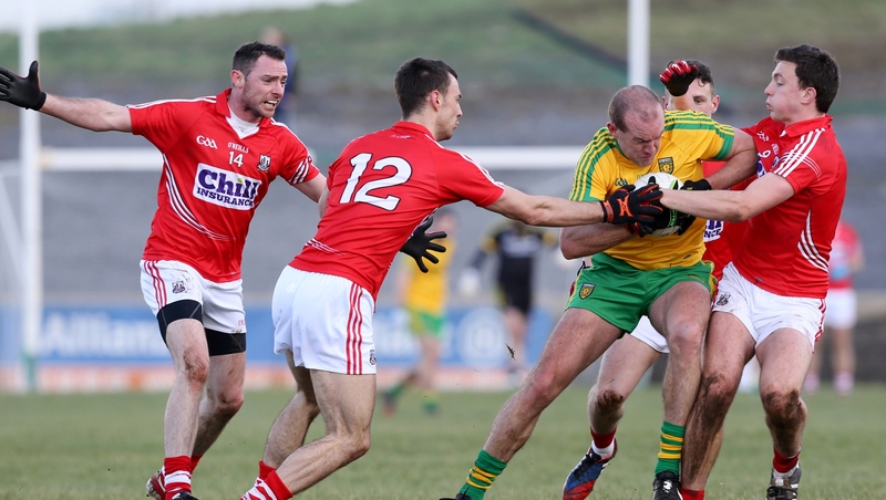 Neil Gallagher of Donegal with Kevin O Driscoll (12) and Mark Collins of Cork
