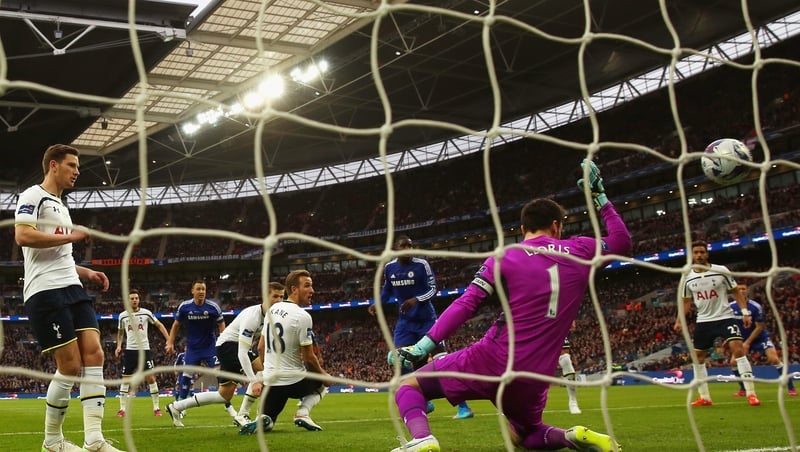 John Terry of Chelsea scores the opening goal past Tottenham goalkeeper Hugo Lloris