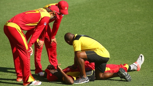 Elton Chigumbura of Zimbabwe grimaces after being injured against Pakistan