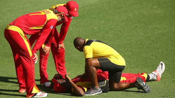 Elton Chigumbura of Zimbabwe grimaces after being injured against Pakistan