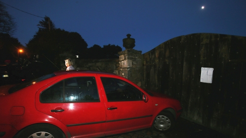 A summons is left nailed to the gates outside Gorse Hill