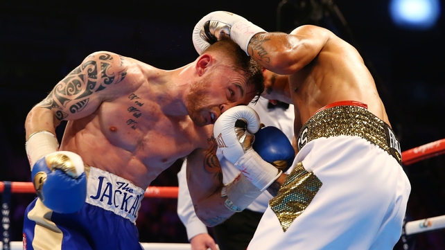Carl Frampton takes a punch from Chris Avalos but would ultimately come out on top during their IBF Super-Bantamweight World title fight on Saturday night