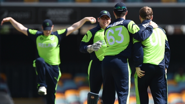 Ireland cricketers Niall O'Brien, Gary Wilson, Andrew Balbirnie and Paul Stirling celebrate after the wicket of UAE batsman Krishna Karate on Wednesday