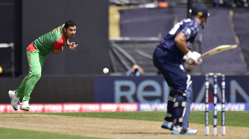 Bangladesh captain Mashrafe Mortaza (L) bowls to Kyle Coetzer, who became the first Scottish player to score a World Cup century
