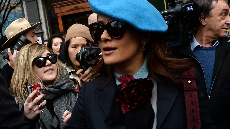 Selma Hayek departs the Gucci show during Milan Fashion Week, February 25