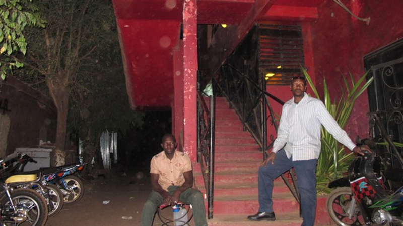 Locals stand outside 'La Terrasse' bar where a gunman opened fire