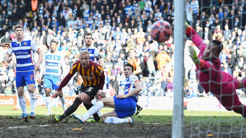 Republic of Ireland internationals Alex Pearce and Stephen Kelly look on as a Bradford chance sails just wide