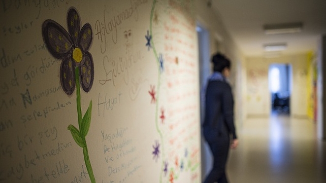 A flower painted on a wall is seen at a women's shelter in Ankara, Turkey