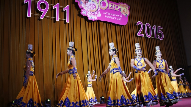 Dancers performing a Mongolian traditional dance during a reception to celebrate International Women's Day in Beijing, China