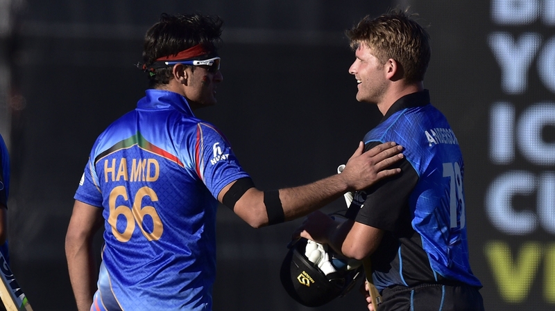 Afghanistan bowler Hamid Hassan (L) congratulates New Zealand batsman Corey Anderson on their win