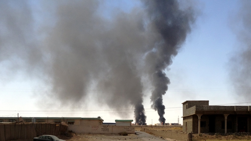 Smoke rises from the Baiji oil refinery in Iraq during clashes between IS and Iraqi forces last year
